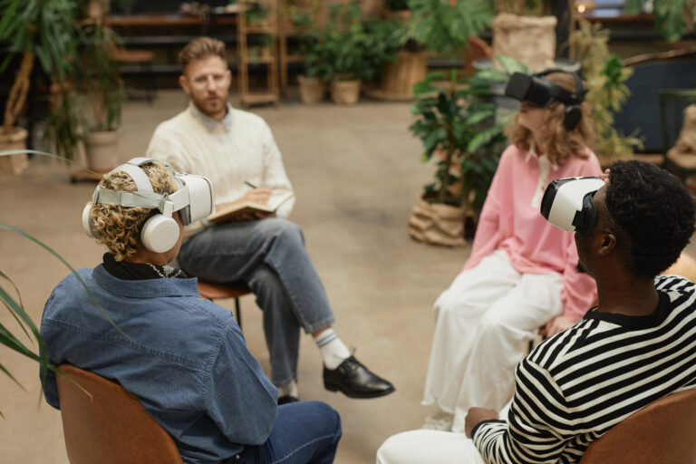 People wearing VR headsets during therapy session